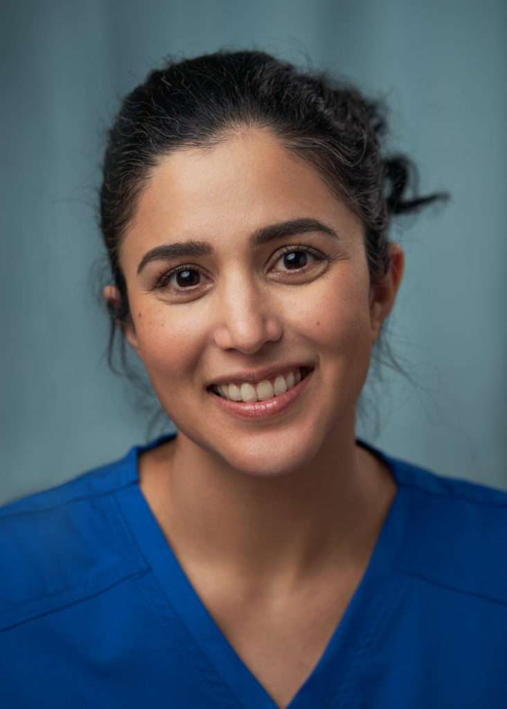 latino actress nurse character blue headshot
