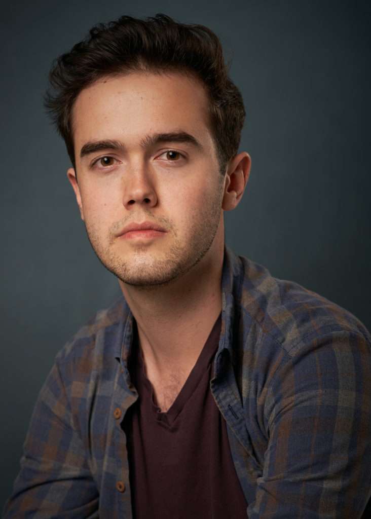 Vancouver male young brown eyes actor photography natural headshots with blue plaid shirt